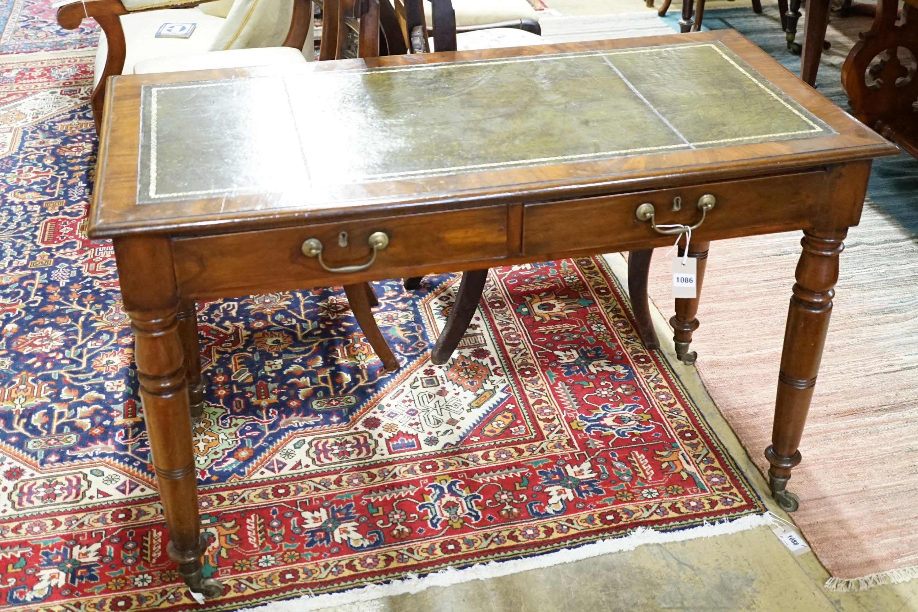 A late Victorian mahogany writing table, width 115cm, height 74cm